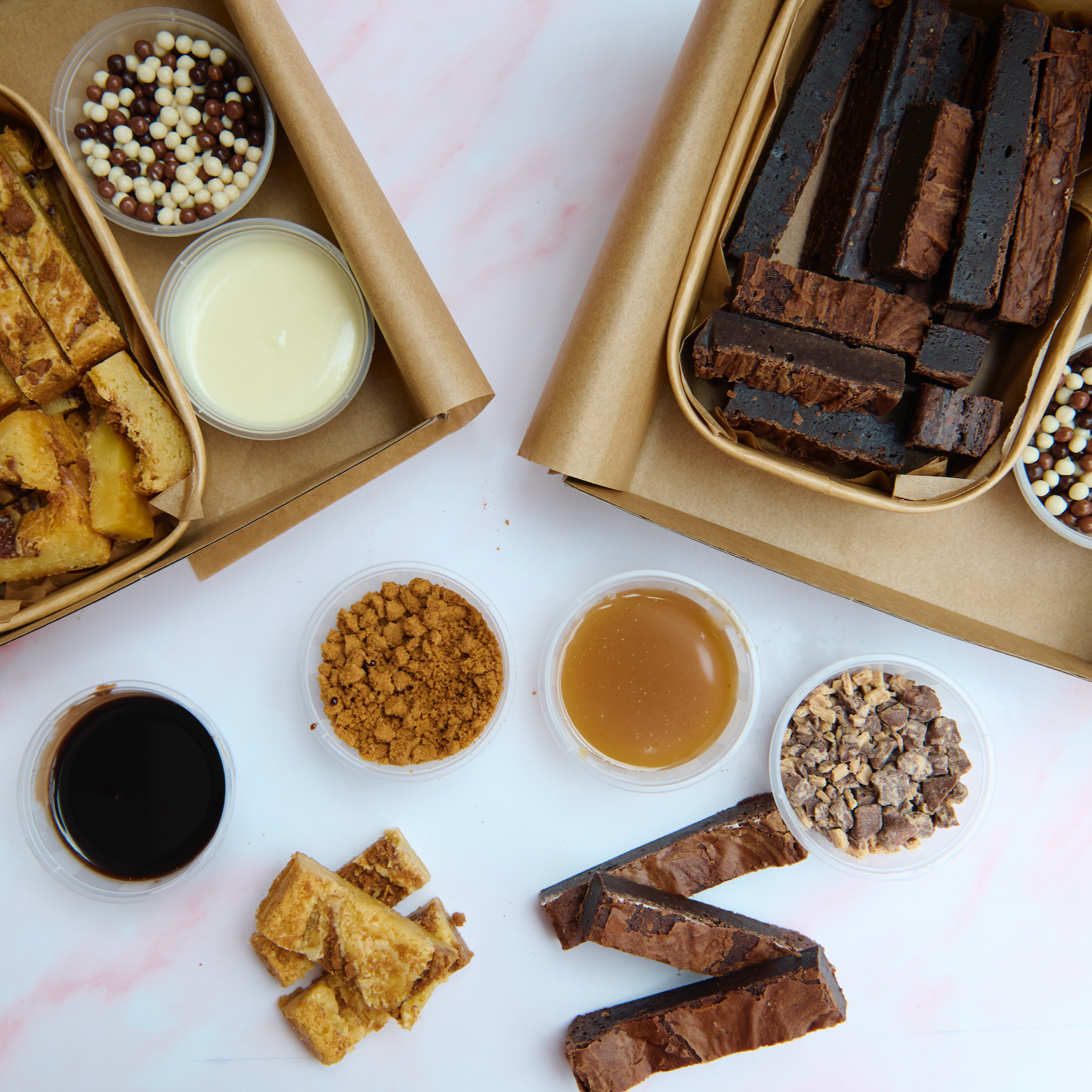 The Brownie Box UK Postal Ultimate Brownie and Blondie Dipping Box Posted Nationwide. Contains Brownies, Blondies, Dipping Sauces &amp; Chocolate Crumb.